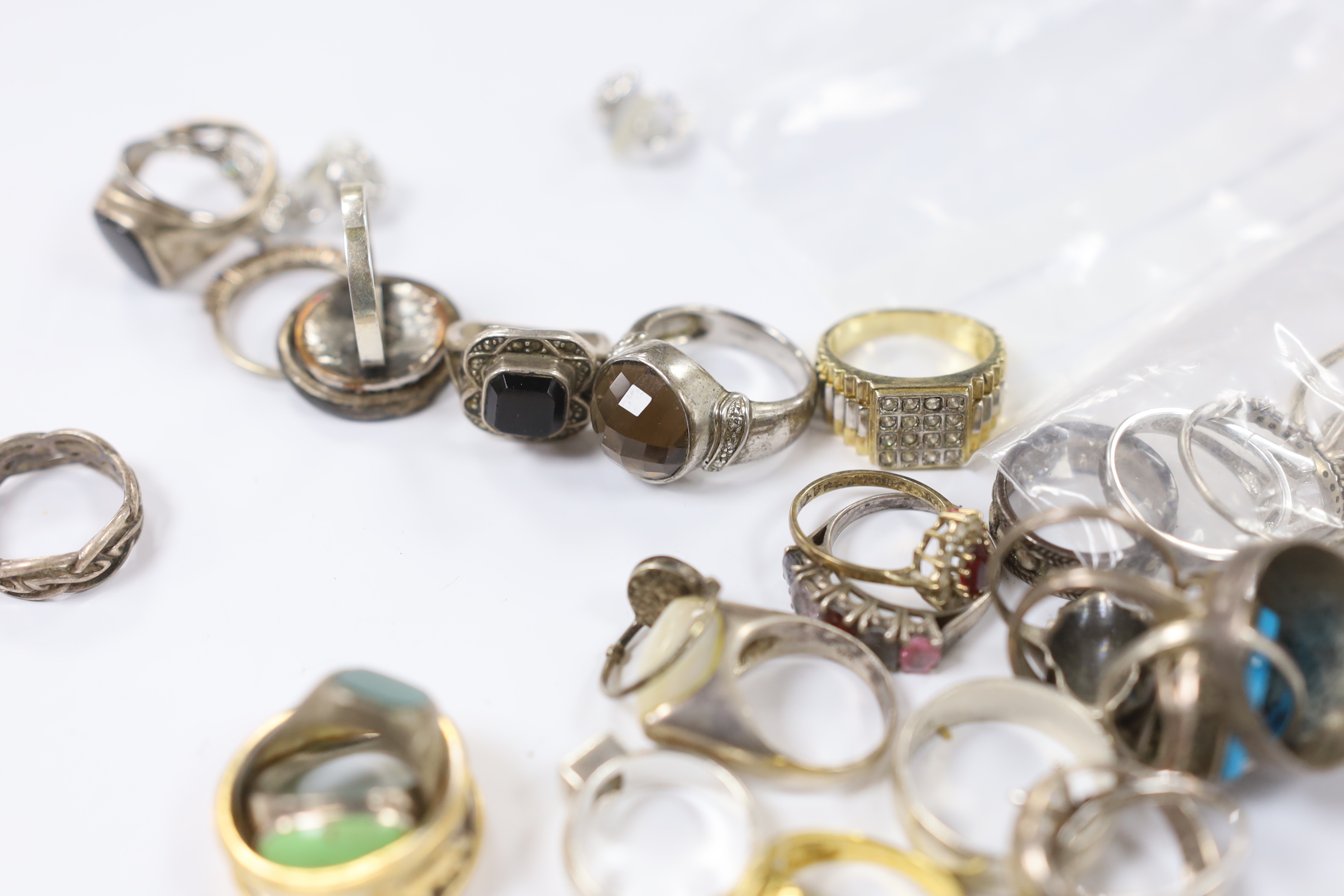 A quantity of assorted mainly white metal and 925 dress rings.